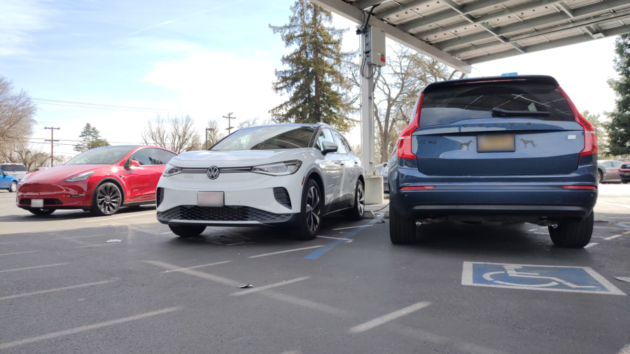 Electric cars are parked along the Amador Valley school electric charging space. 
