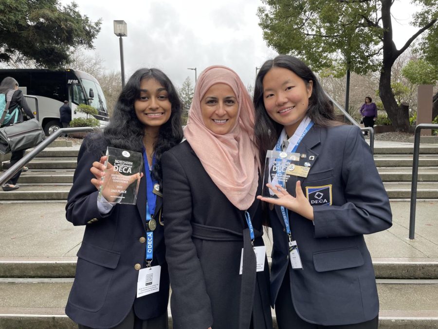 Rabia Marjan (center) poses with 2022-2023 Amador Valley DECA Co-Presidents Andrea Yang (23) and Pallavi Shankar (23).