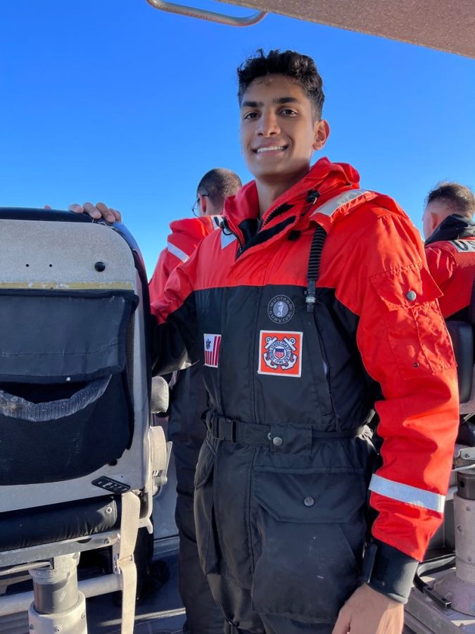 Sameer Ramakrishna on a coast guard boat during a coast guard summer camp in NSCC.