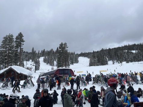 Taken at the top of a slope at the Northstar Skiing Resort, snowboarding brings joy for many people.