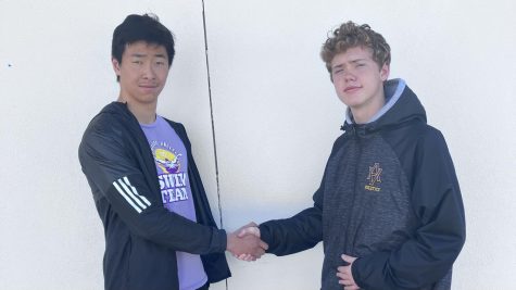 On campus, Chinese AV students Andrew Xiao (23) and Preston Elliott (24) shake hands in light of the recent tension. 