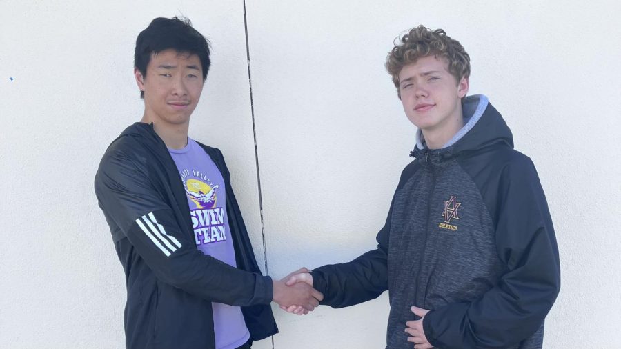 On campus, Andrew Xiao (23) and Preston Elliott (24) shake hands in light of the recent tension. 