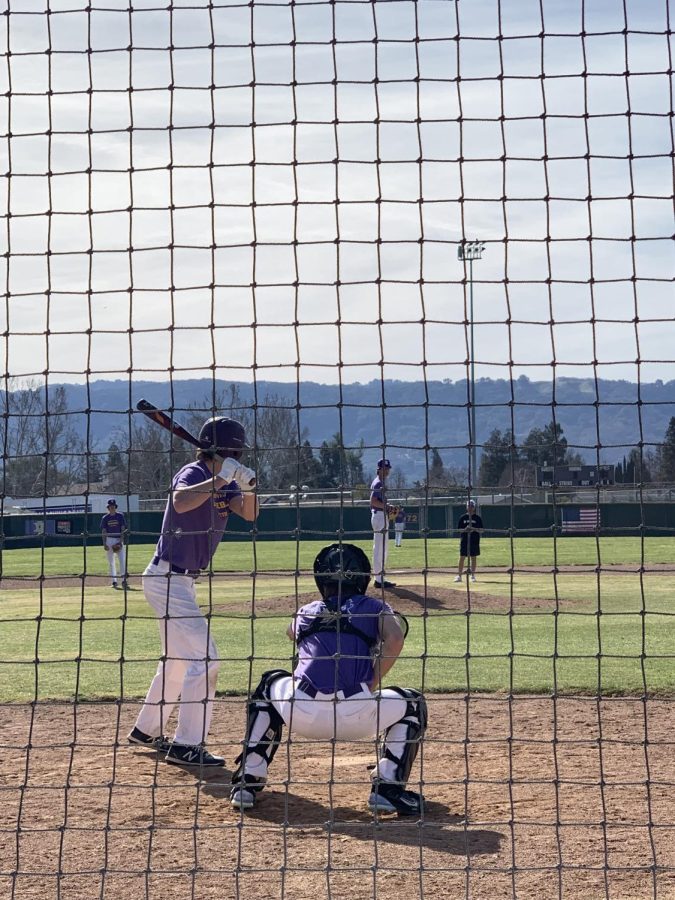 Matthew Foley(24) takes the plate against his younger brother Aidan Foley (25).