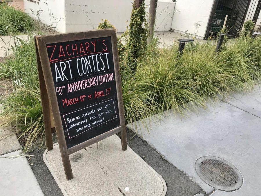 Downtowns Zachary’s Pizza is celebrating its 40th anniversary with an art contest open to anyone in the community.