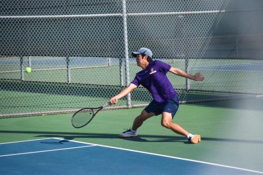 Bryan Park slides across the court to keep the ball in play.
