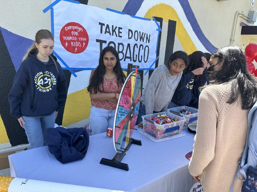 Students gathered around the C building to check out the Take Down Tobacco booth.