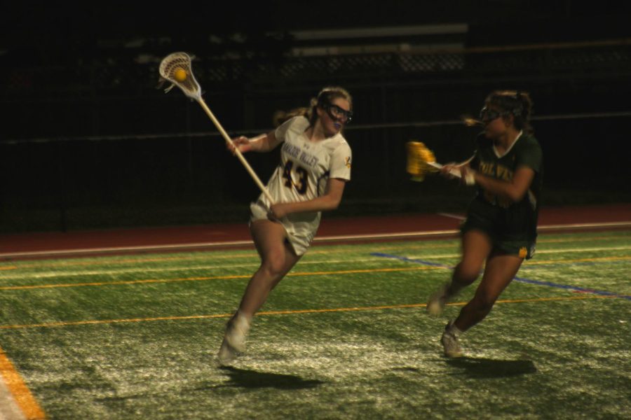 Tatum Krekorian ('24) charges at the goal looking to score for Amador.