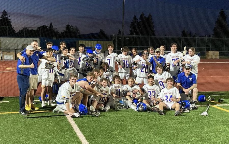 Foothill lacrosse team with the Mike Lambrecht Helmet after winning the rivalry game.