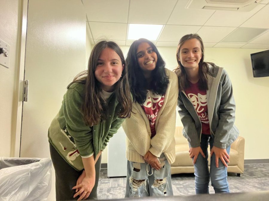 Anna Fietelberg (23), Sruthi Kumar (24), and Lucie Bernard (23) pose for a photo after their December show.