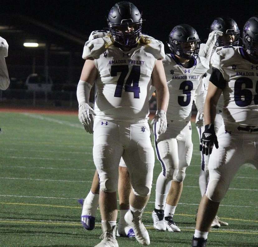 AJ Johnson walks up to the line of scrimmage to get set for the play.