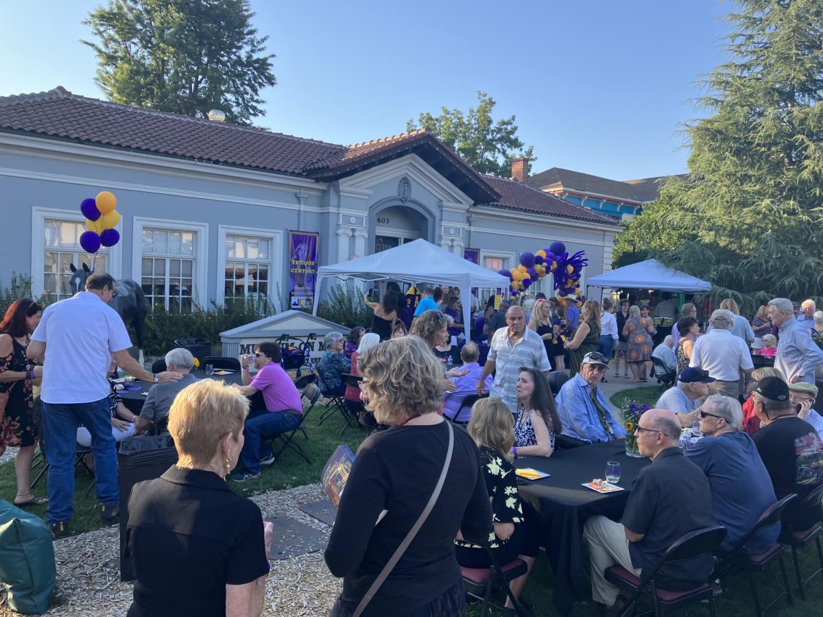 The reception takes place right in front of the Museum on Main with tables and chairs set up for the guests.