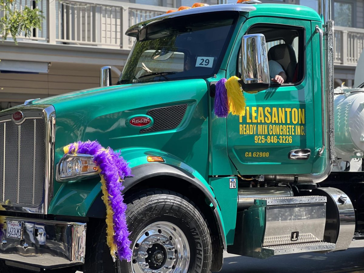 The last part of the parade saw floats of the centennial's various sponsors, including a Pleasanton Ready Mix Concrete truck decked out in Amador colored decorations.