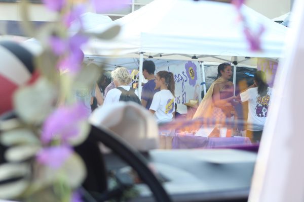 The Pigskin festival seen through the window of the volleyball team's parade float. 