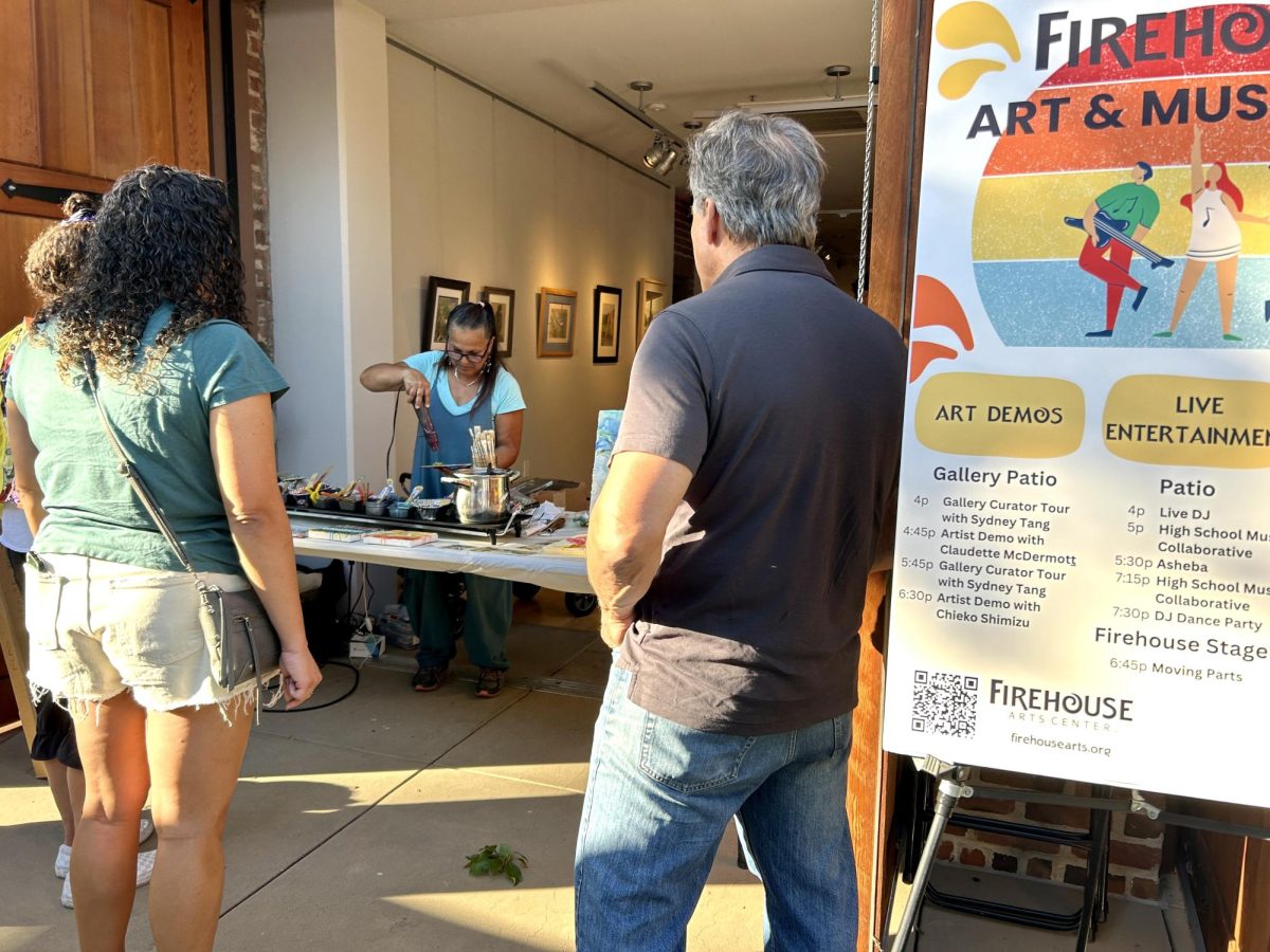 An artist performs a live demo in front of the visitors.