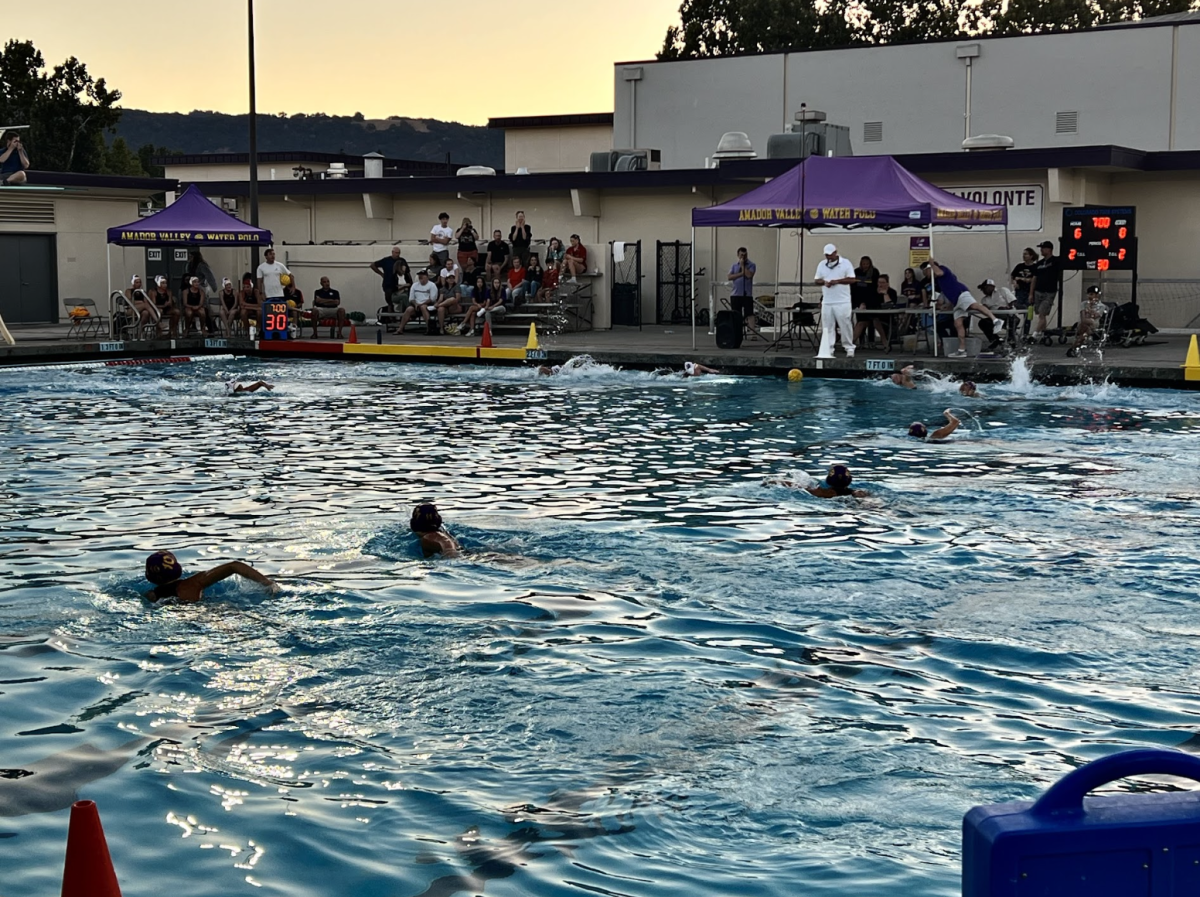 During the final quarter, the Dons sprint for the ball in hopes for a game-deciding goal.