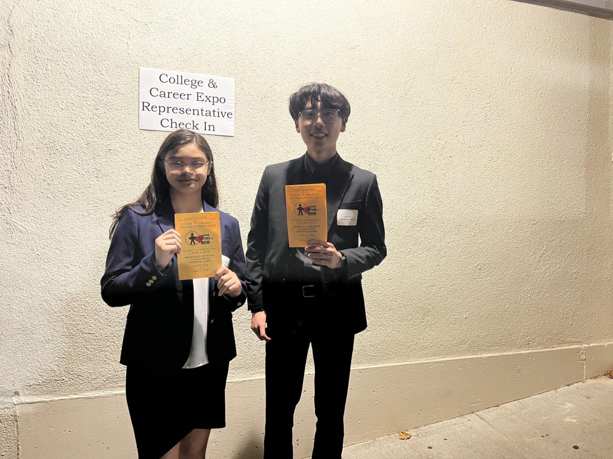 Aurora Nicolas (26) and Roy Kim (25) proudly display the cumulation of their hard work.