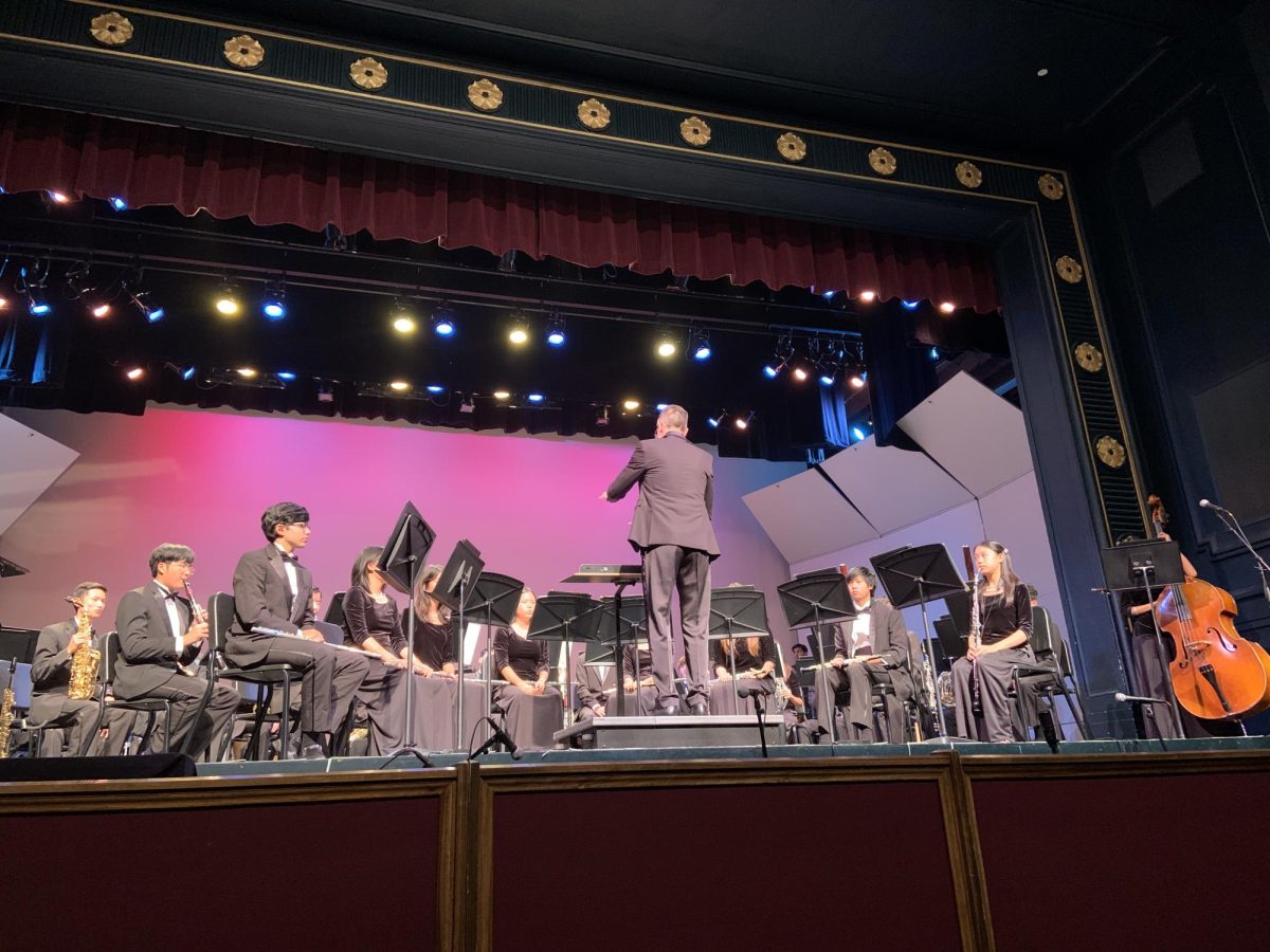 Jonathan Grantham, Director of Bands, conducts Wind Ensemble I during the final piece of the night, Danzón No. 2