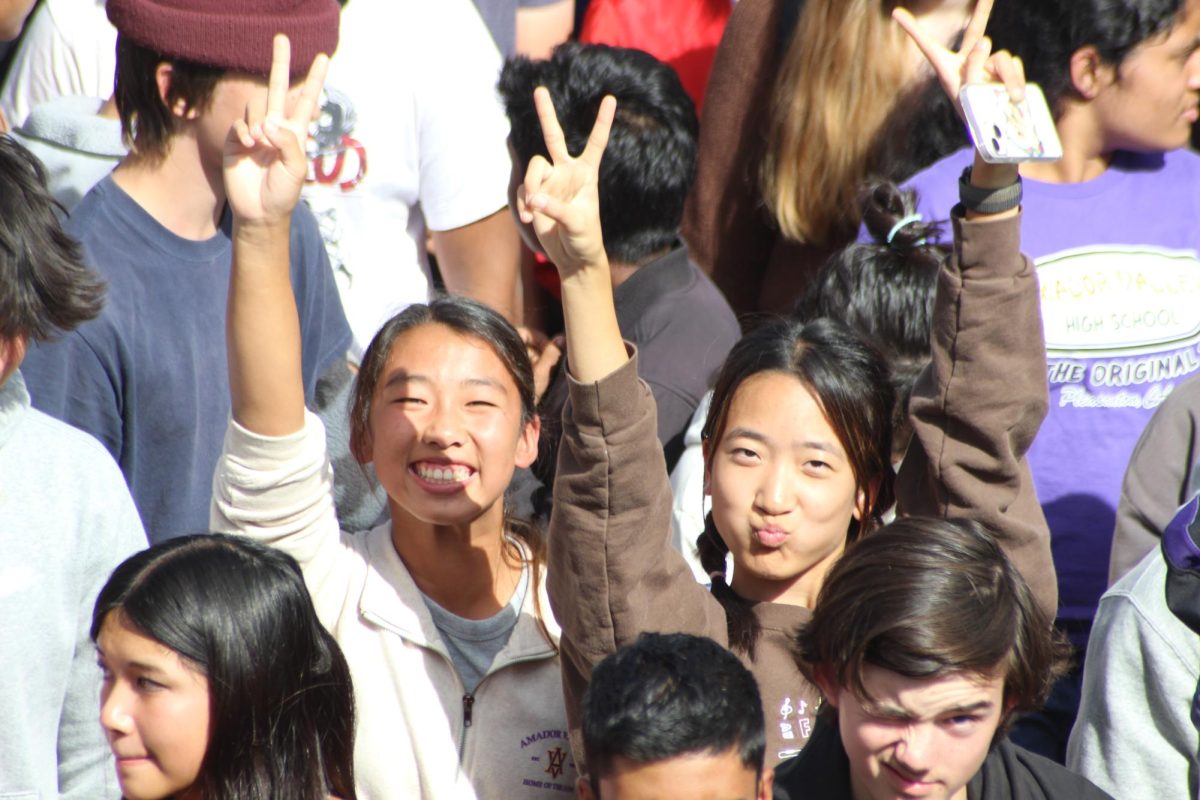 Freshmen Grace Chloe (27) and Brian Ma (27 pose for the camera as they head back to class. 