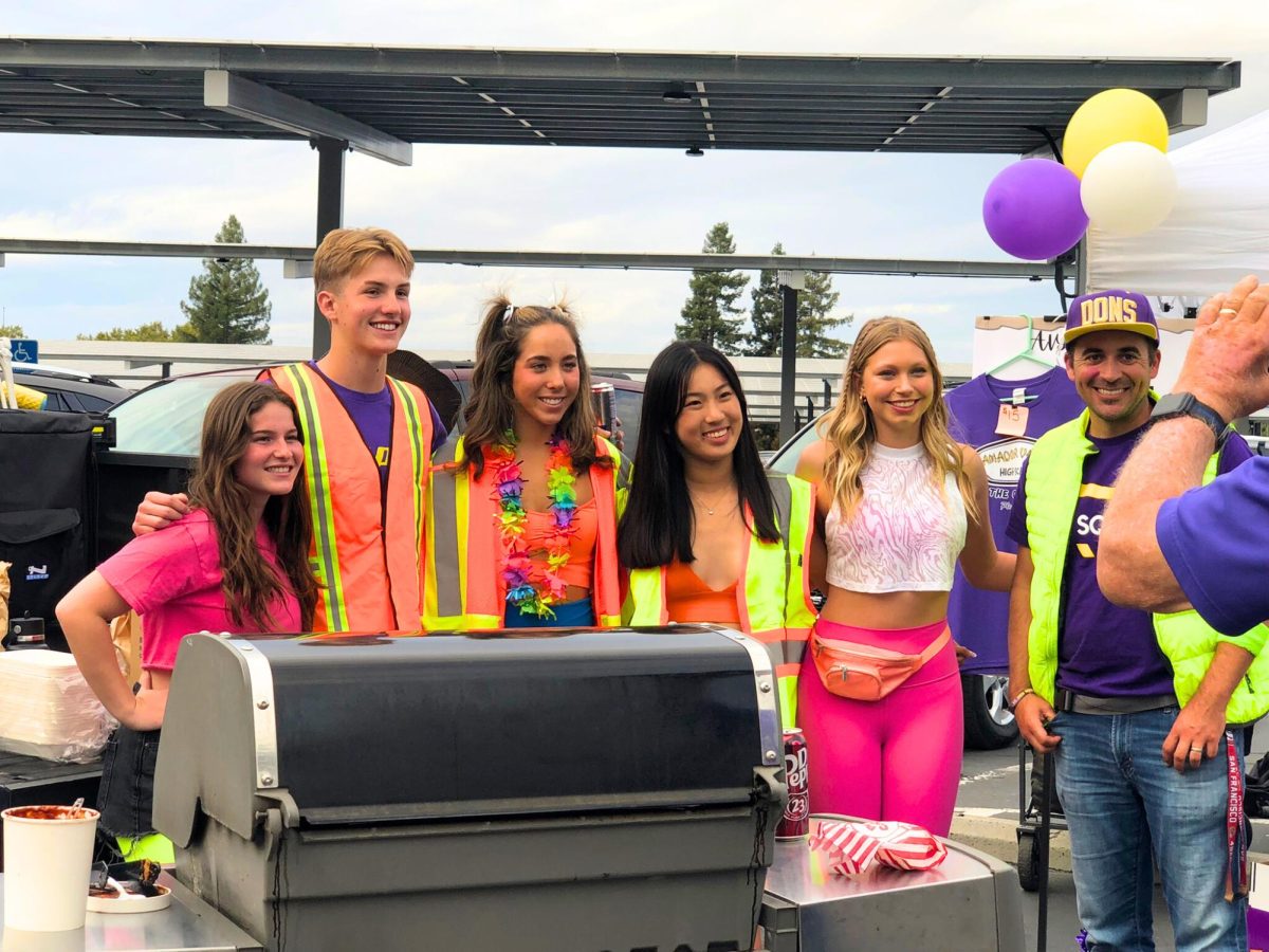 Don Squad poses for the camera with there neon fits. 