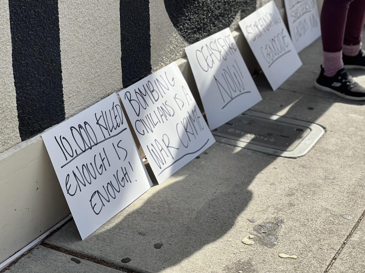 As the day went on, two assiduous students stood by their signs and made sure all of them were visible to onlookers.