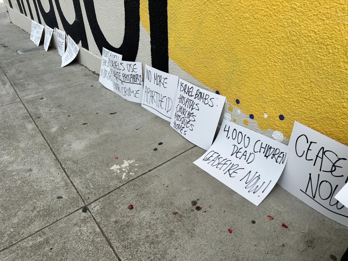 As the day went on, two assiduous students stood by their signs and made sure all of them were visible to onlookers.