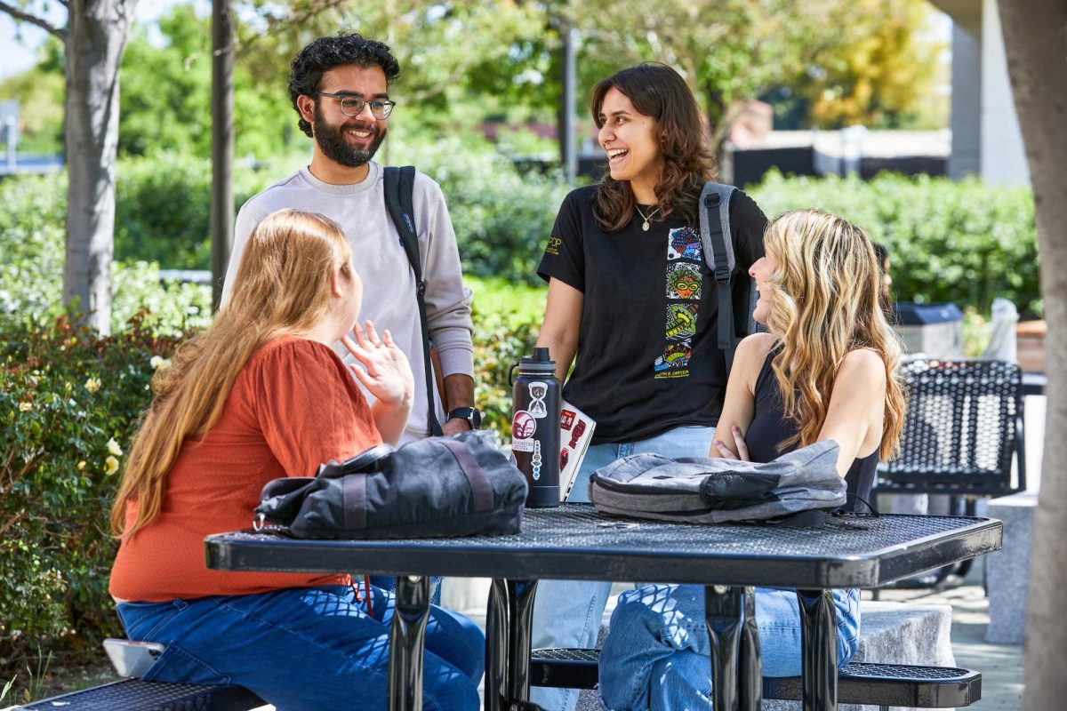 Las Positas students share a laugh as they converse between classes.