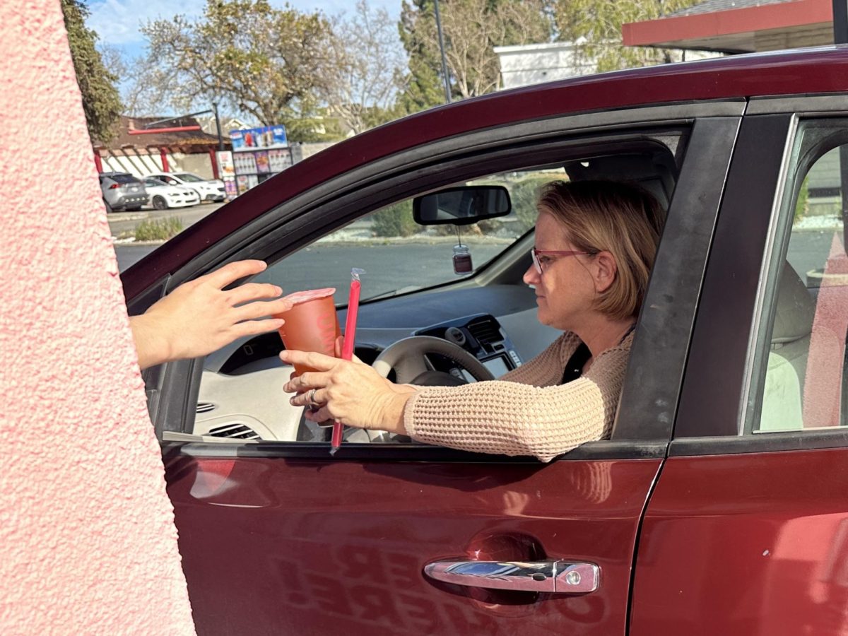 Customers are handed their drinks as soon as they order from the drive-thru. 
