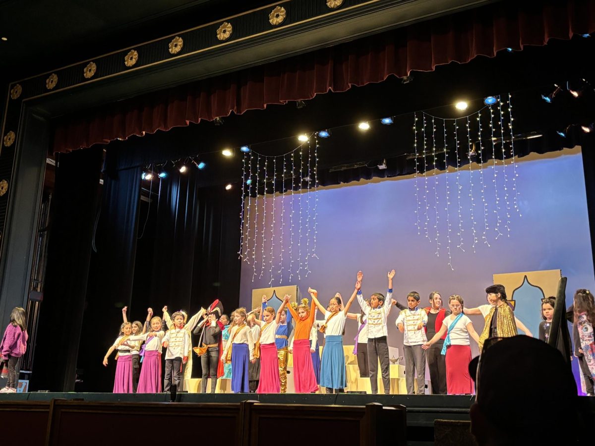 The entire cast joins together and takes their final bow, wrapping up the musical.
