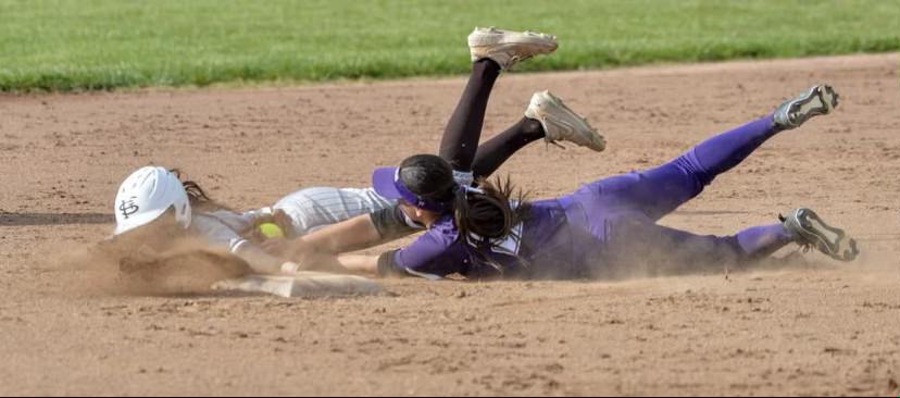 Falcone dives for the ball, proving her determination and drive.