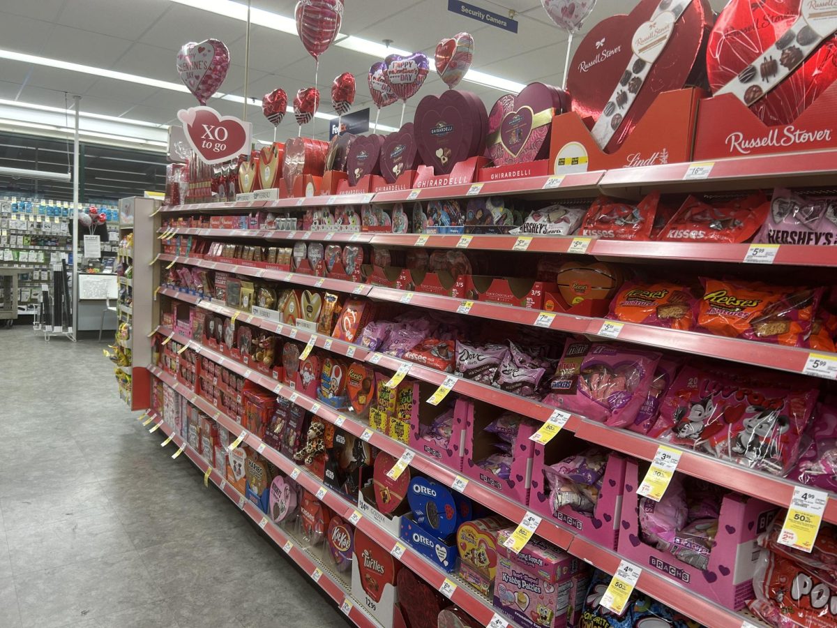 Vibrant colors of pink and red fill several aisles in stores as Valentines Day approaches.