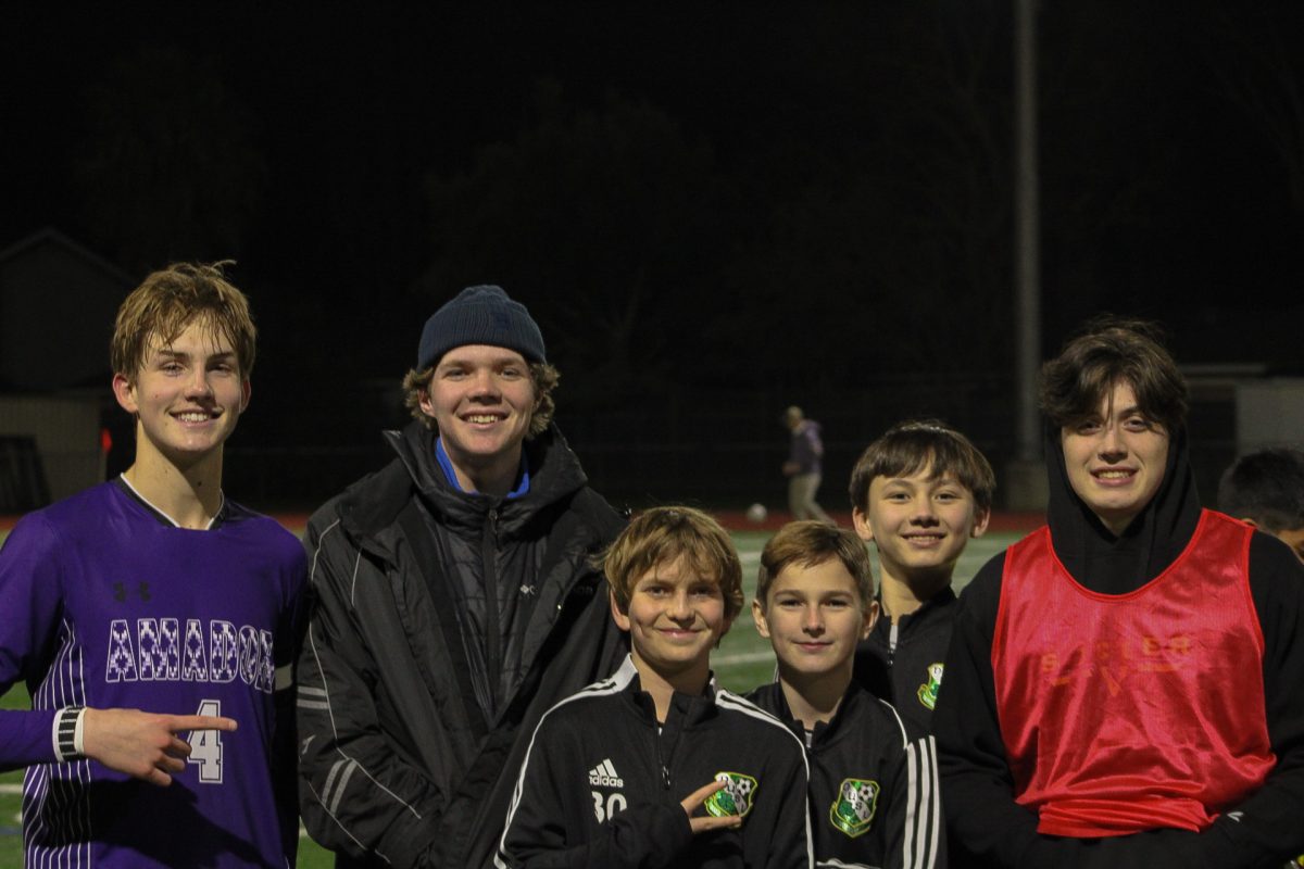 Isaac Hilton ('24), Riley Borges ('24), Braden O'Donnell ('24) pose with the next generation of Dublin High School Soccer players. Maybe Dublin could've used them as forwards!
