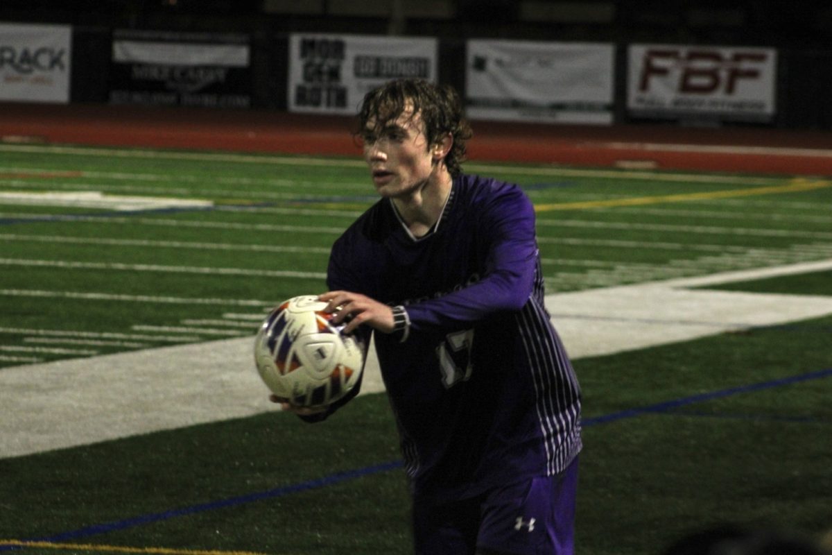 Full back Coleson Franklin ('25) prepares a throw in after Dublin kicks the ball out once again. 