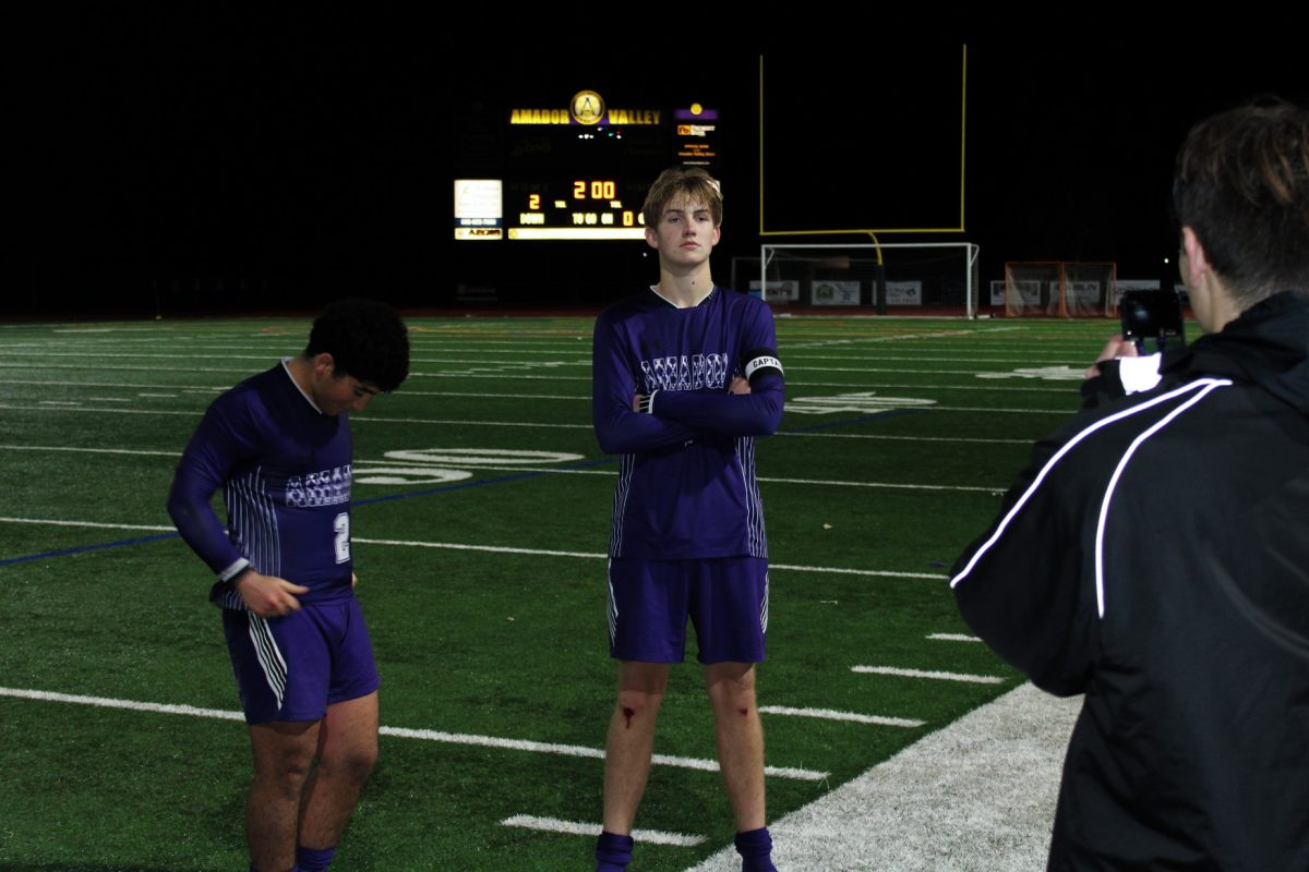 Goal scorers Ramsey Hanna ('25) and Isaac Hilton ('24) pose for a photo with the scoreboard after an exciting game.