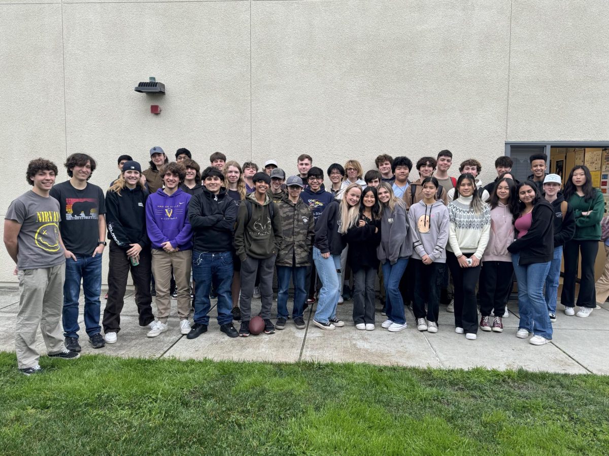 Members of AV Fishing Club pile outside Mr. Lors classroom for a group photo.
