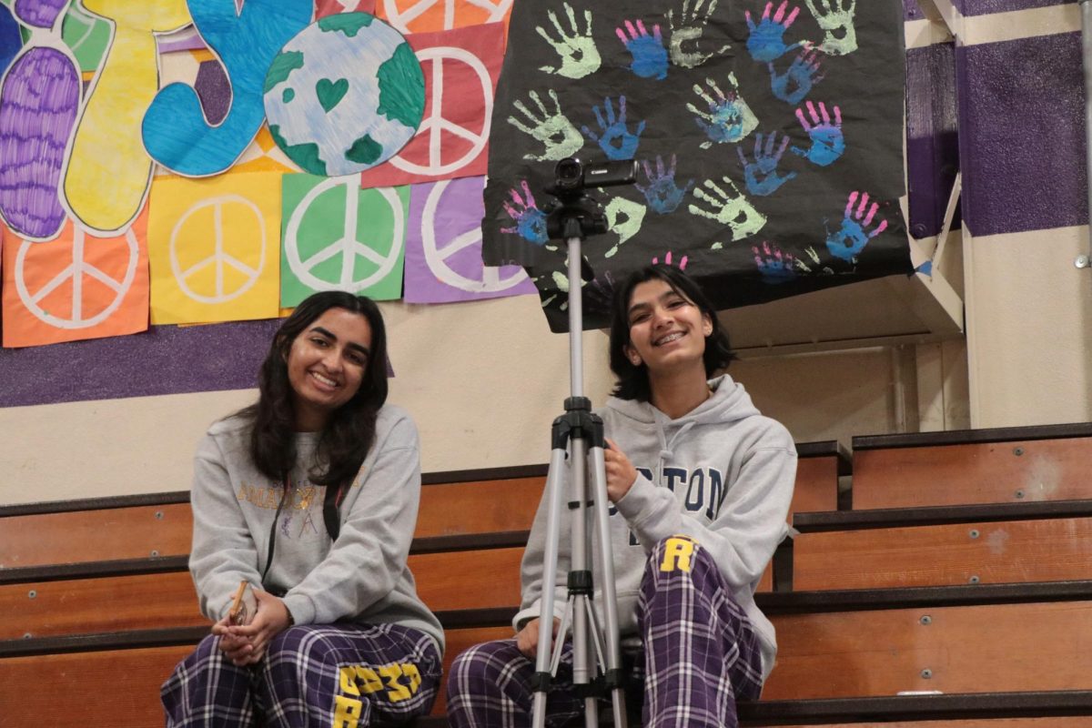 Amador Valley Journalism writers Ritika Gupta ('24) and Max Dye ('26)  pose for a picture while they capture the Donversity Rally. 
