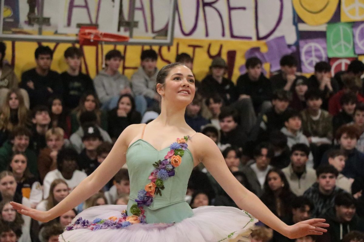 Katherine Foster (24) stuns the crowd with impressive footwork and coordination during her ballerina dance routine. 