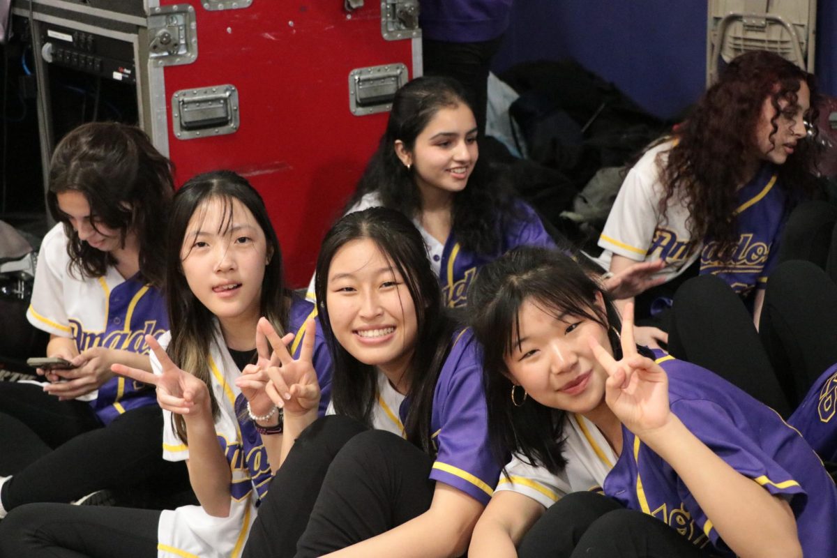 Peace out! Girl's dance team poses for a pre-performance photo. 