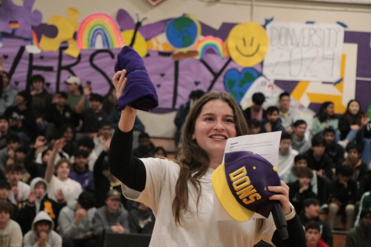 2024 Donversity Rally MC Olivia Medinas ('24) keeps the audience engaged and excited with a free t-shirt throw. 