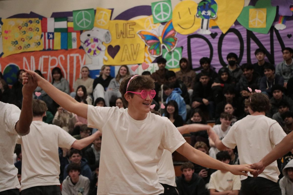 Cooper Mapes ('25) smiles and dances for the 500-plus student crowd. 