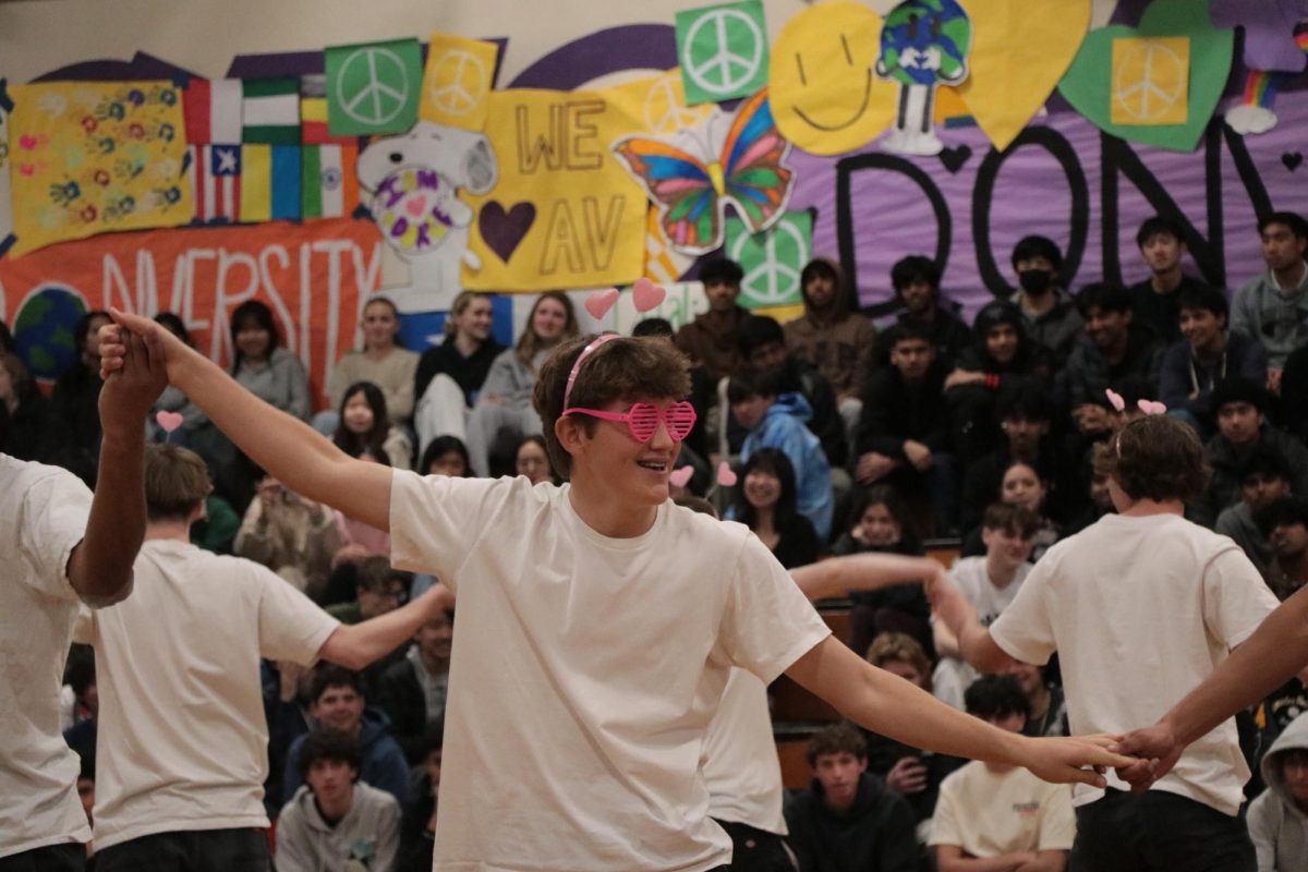 Cooper Mapes (25) smiles and dances for the 500-plus student crowd. 