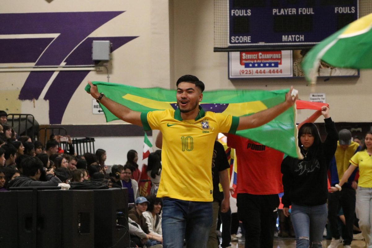 Luke Bell (24) represents his Brazilian background with a Brasil flag and jersey.