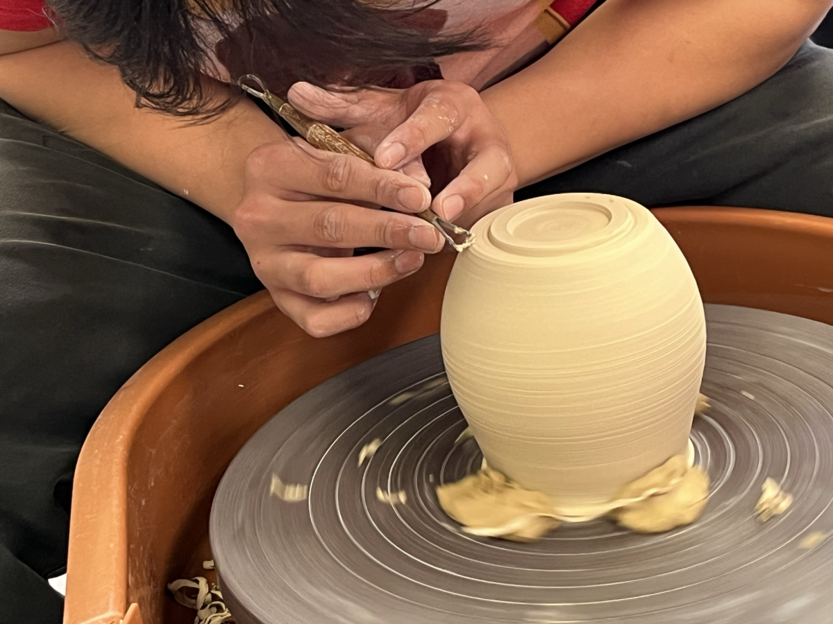 Thomas Le ('24) uses a potter's wheel