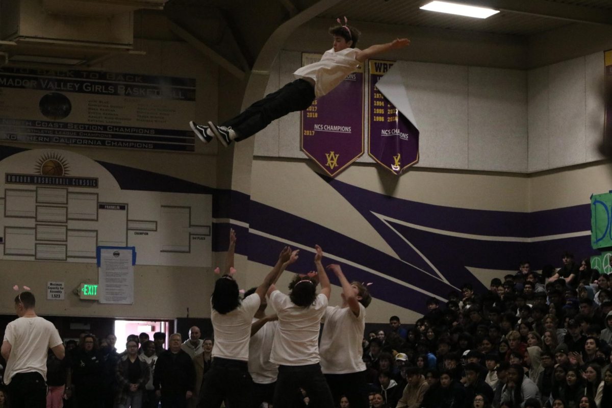 In an unexpected move, Cooper Mapes ('25) goes flying through the air as his Mr. Amador team launches him like a cheerleader. 