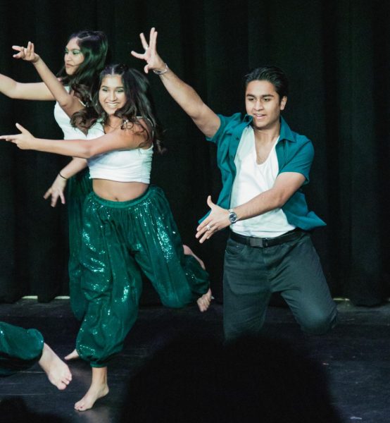 Zenil Koovejee (24) performs on the stage at a Bollywood showcase. 