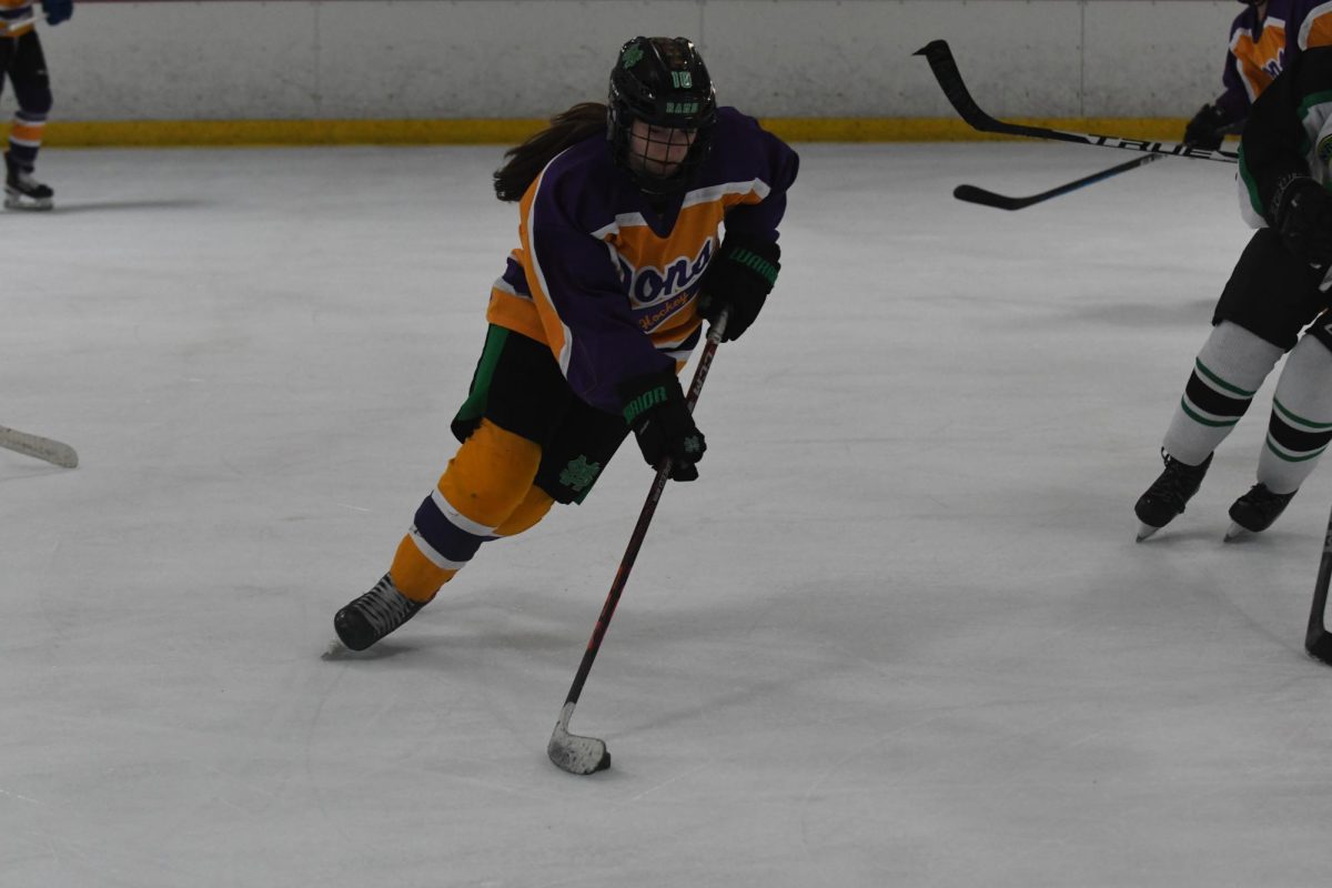 Byrd keeps her eyes on the puck as she looks for opening to score.
