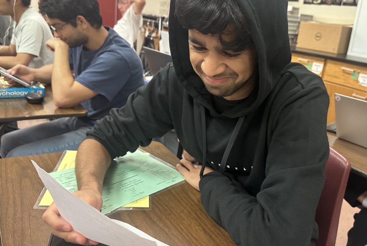 Aayush Gupta (24) opens his freshmen letter to self.