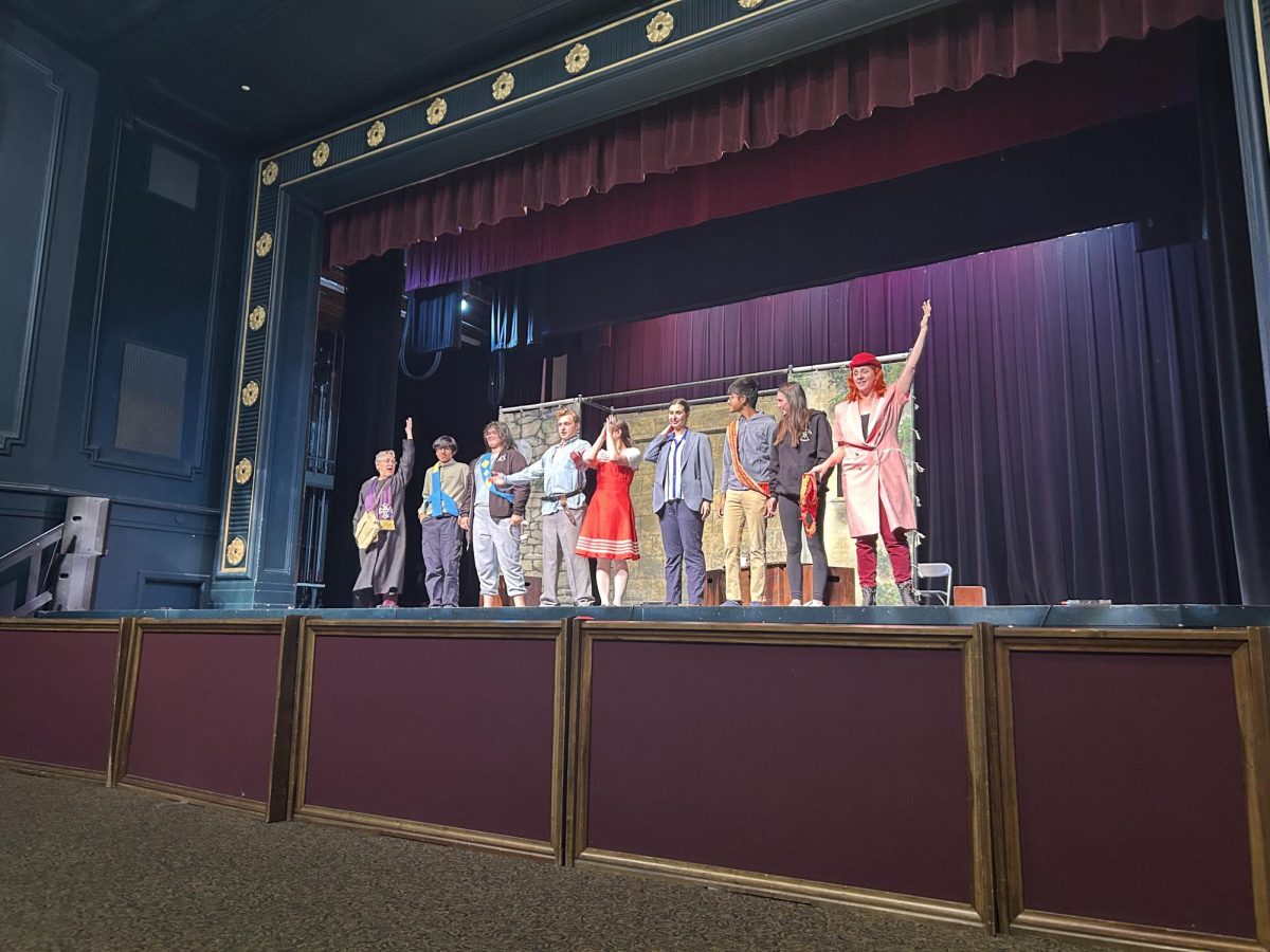 The cast—and student audience participants—take their bow.