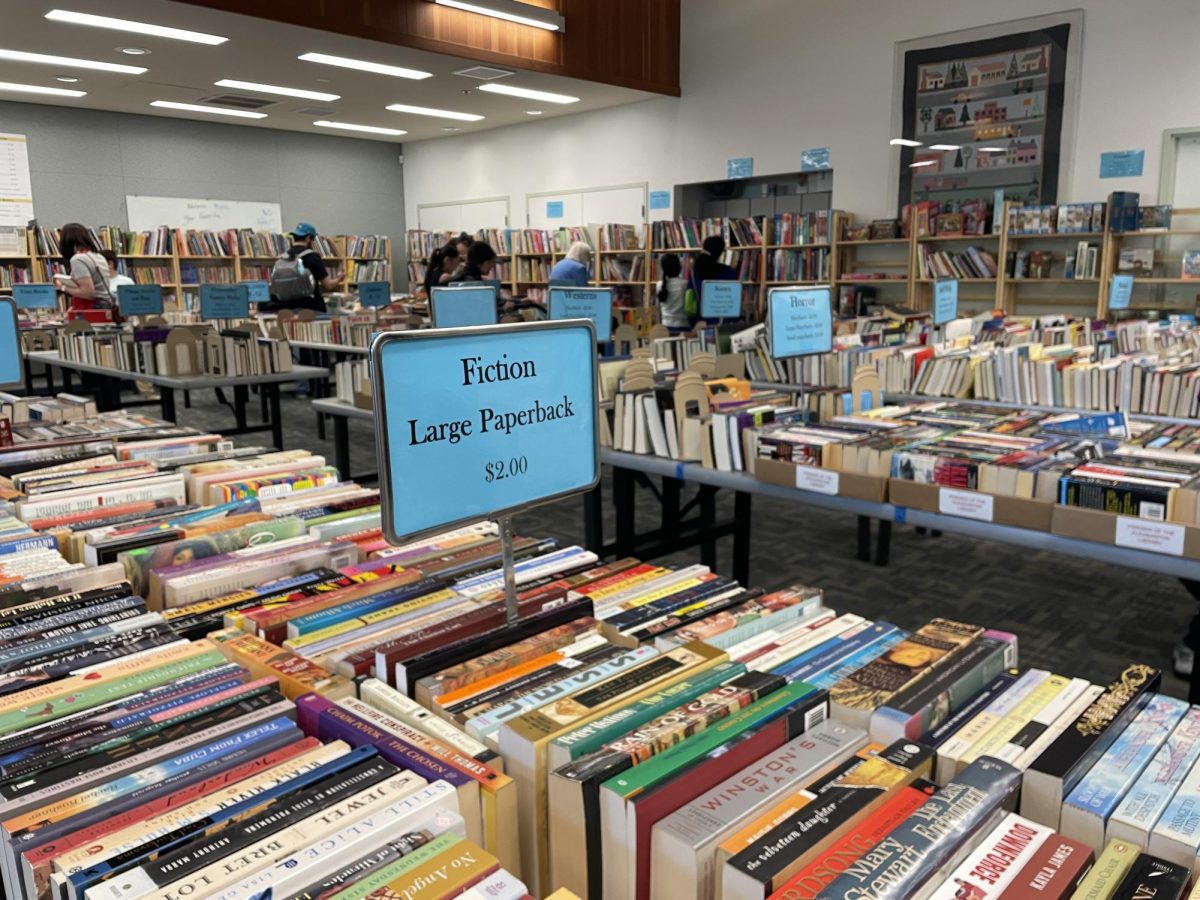 Volunteers collected and sorted books by genre, using signs to streamline searching.