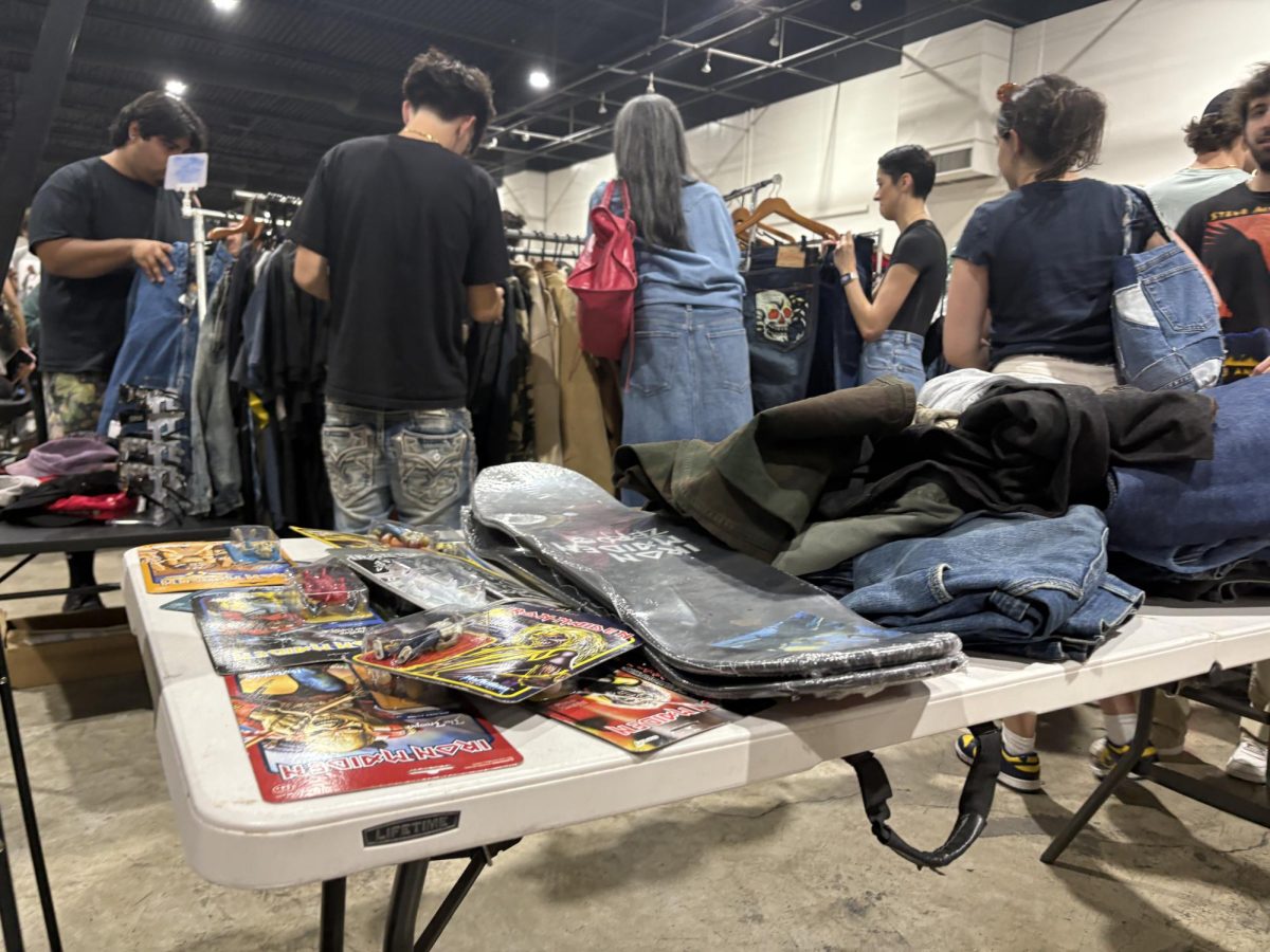 Shoppers sift through racks of pre-owned clothes at Thrift Fest that took place on Saturday, September 20 this year.