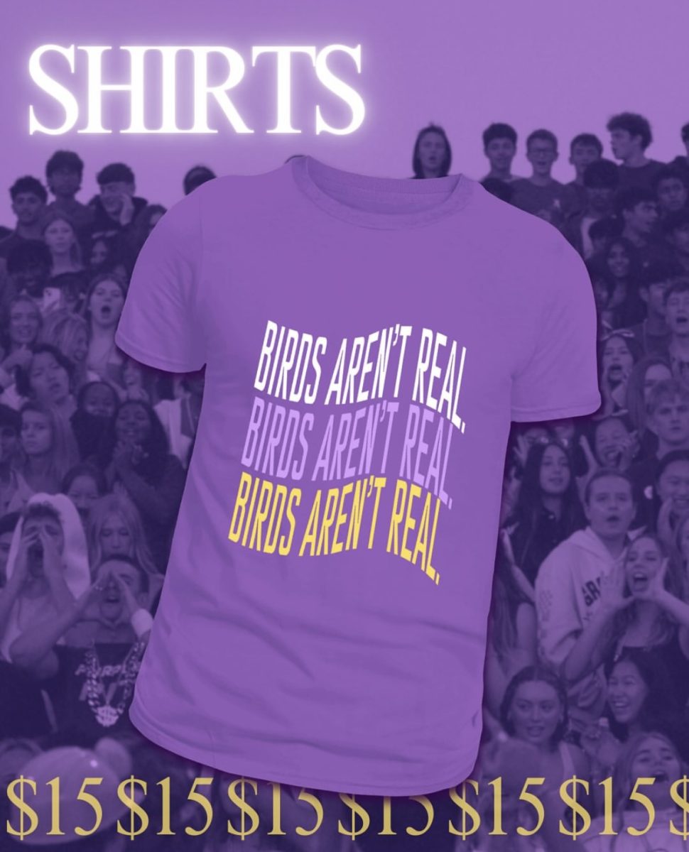 Students decked out in their spirit wear, painting the student section purple for rivalry.